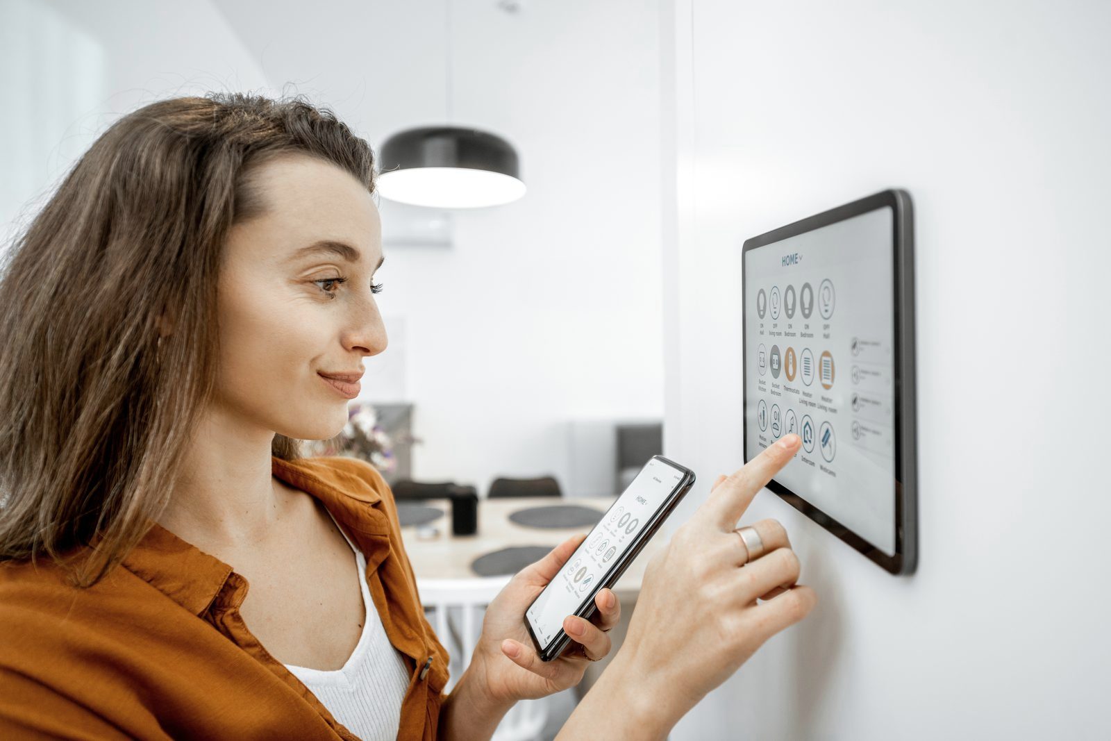 Controlling a smart home from a wall panel and phone